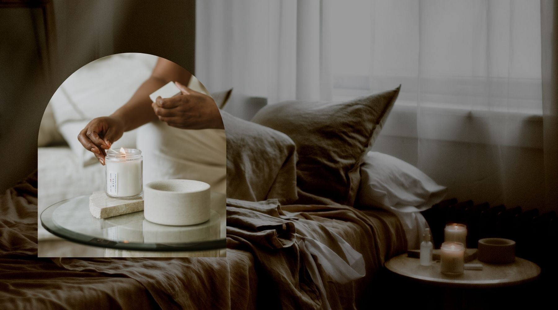 Woman is lighting an Atmosphere Threesixty Aromatherapy Candle on her side table, and there are additional candles lit beside her bed.