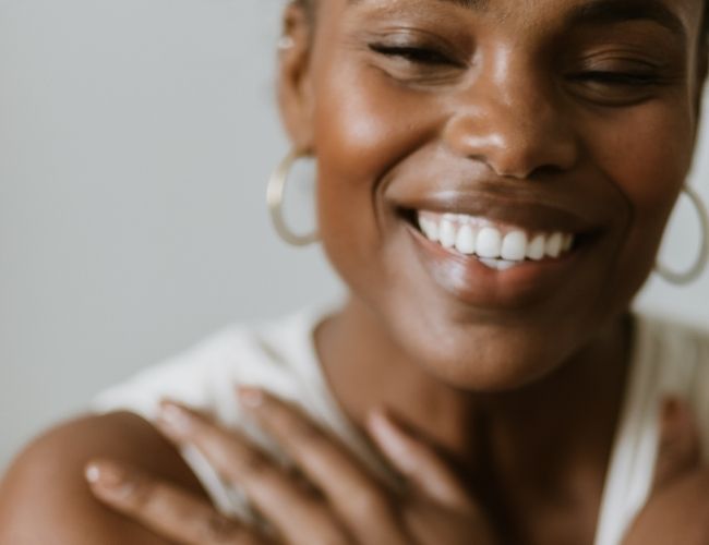 Woman is experiencing a sense of peace and calm after {re}connecting with herself and healing.